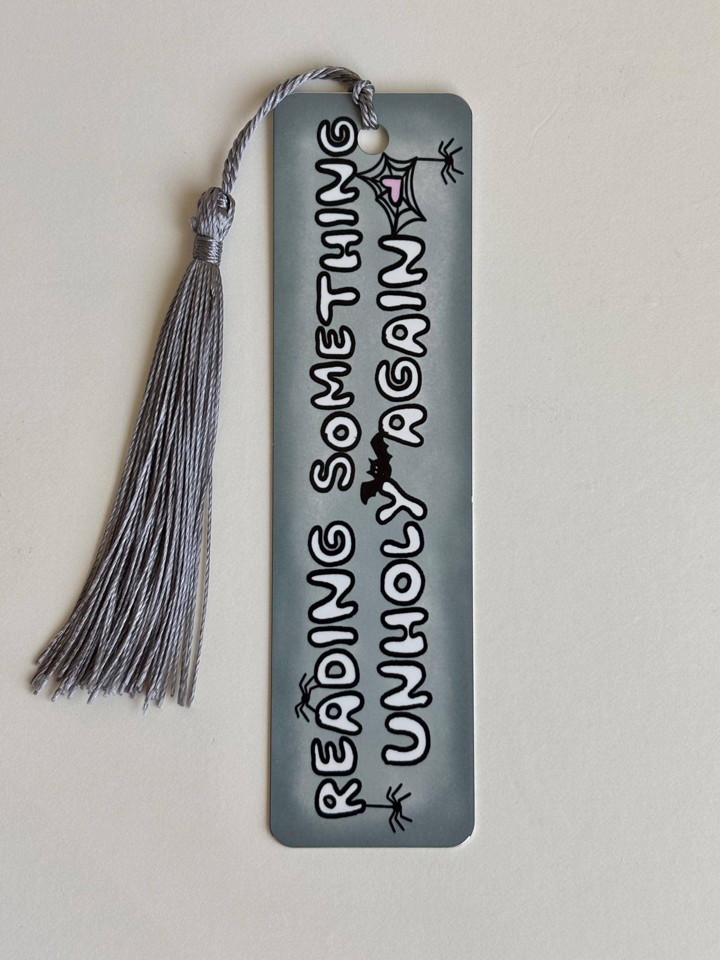 Reading something unholy again metal bookmark: Short