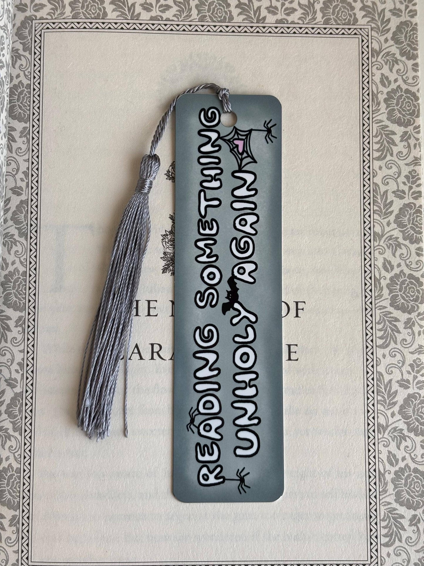 Reading something unholy again metal bookmark: Short